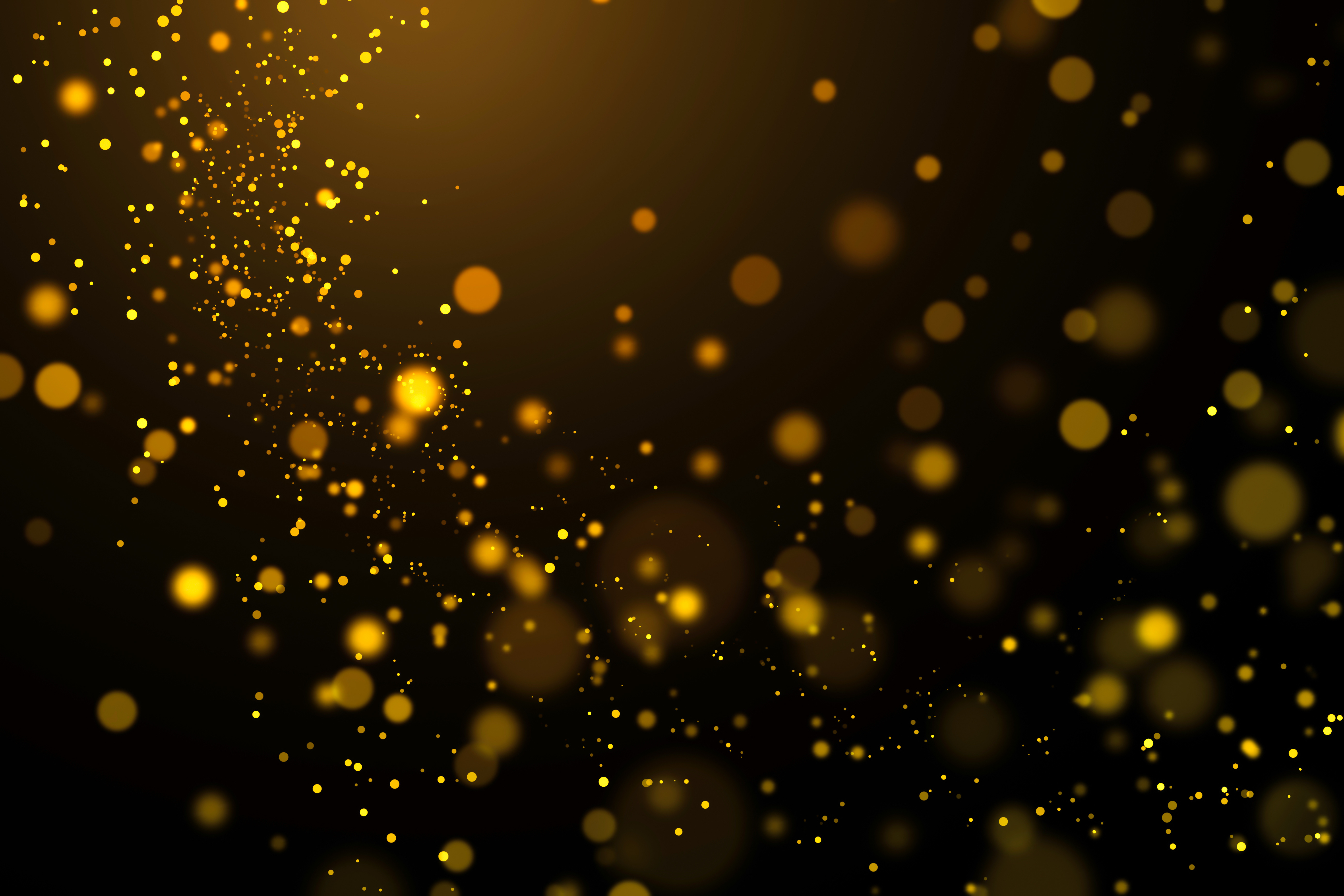 Gold Glittering Light Bokeh in Dark Background